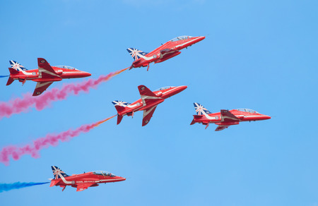 CLEETHORPES, ENGLAND JULY 27TH: Royal Air Force Red arrows perform an aerobatic display at Cleethropes airshow on 27th July 2014 in Cleethorpes England.のeditorial素材