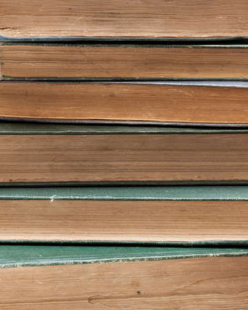 Pile of very old books background books are around 100 years old!の写真素材