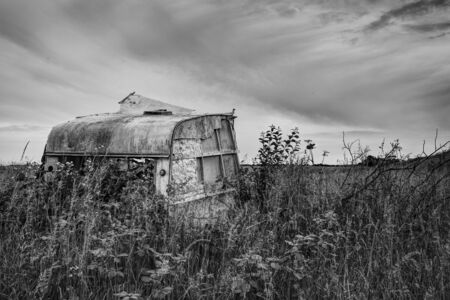 Old caravan in lincolnshire with view of woldsの写真素材