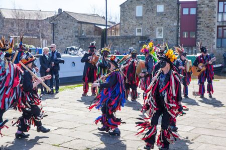 SKIPTON ENGLAND APRIL 6TH: Morris dancers put on a public display with dancing in Skipton on 6th April 2015 in Skipton England.のeditorial素材