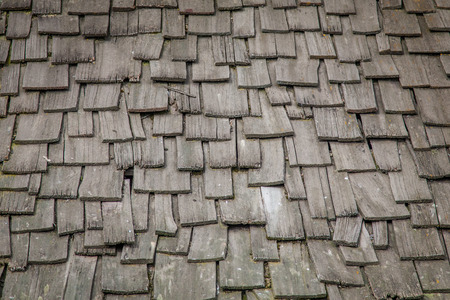 An old wooden rood with wooden roof tilesの写真素材