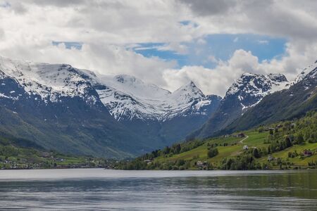 norwegian fjord with moutains and waterの写真素材