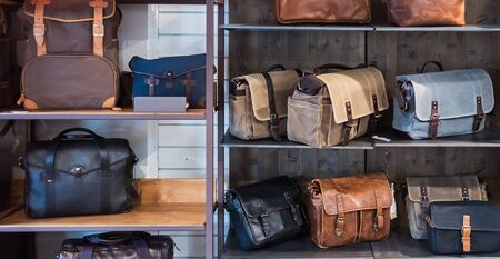 Luxury leather camera bags on a shelf