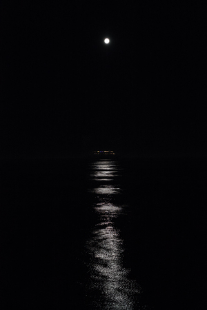 Moon and sea at nightの写真素材