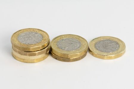 New Uk Pound coins in a stack