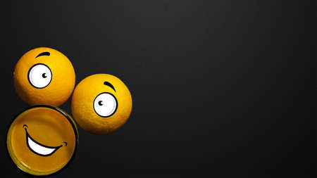 Black background. Abstract face made from oranges and glasses of juice on a black background.の写真素材