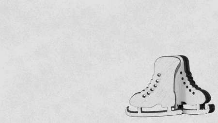 Toy figure skates on a gray background.の写真素材