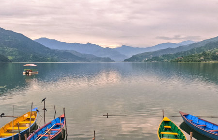 Boats anchored along the Pokhara valley in Phewa lakeの写真素材
