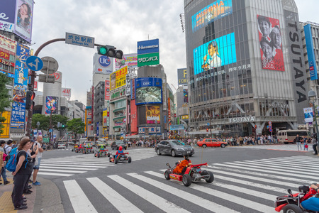 Shibuya, Tokyo, Japan - April 30, 2018: Shibuya, Tokyo, Japan - April 30, 2018: Mario kart on Shibuya district in Tokyo, Japan. Shibuya Crossing is one of the busiest crosswalks in the world.のeditorial素材