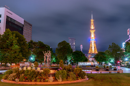 Odori park, the central park, with dance woman statues stand and fountain decorated in front of TV Tower. Sapporo, Hokkaido, Japanのeditorial素材