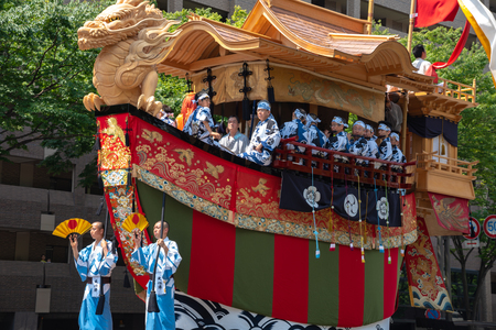 Gion Matsuri Festival, the most famous festivals in Japan. Participants in traditional clothing pulling a highly decorated huge float in the parade.のeditorial素材