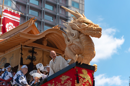 Gion Matsuri Festival, the most famous festivals in Japan. Participants in traditional clothing pulling a highly decorated huge float in the parade.のeditorial素材