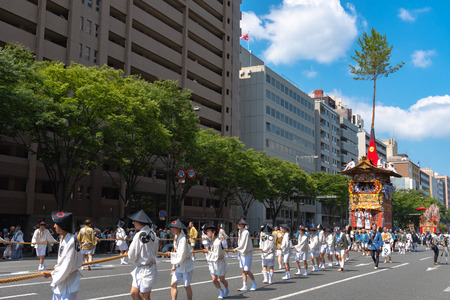 Gion Matsuri Festival, the most famous festivals in Japan. Participants in traditional clothing pulling a highly decorated huge float in the parade.のeditorial素材