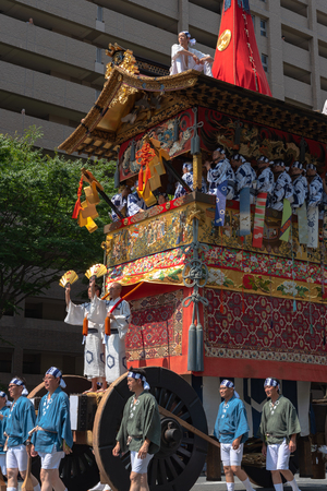 Gion Matsuri Festival, the most famous festivals in Japan. Participants in traditional clothing pulling a highly decorated huge float in the parade.のeditorial素材