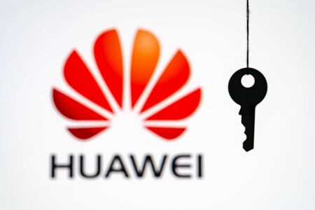 Huawei logo in background with silhouette of a key