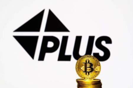 Gold Bitcoin coins with the Visa Plus System logo on background screen. A new type of business finance conceptのeditorial素材
