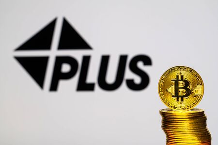 Gold Bitcoin coins with the Visa Plus System logo on background screen. A new type of business finance conceptのeditorial素材