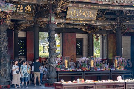Believers pious worship in the Bangka Longshan Temple. Is a Chinese folk religious temple in Wanhua District.のeditorial素材