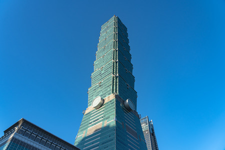 Taipei 101 skyscraper building close up view over dark blue sky. formerly known as the Taipei World Financial Center.のeditorial素材