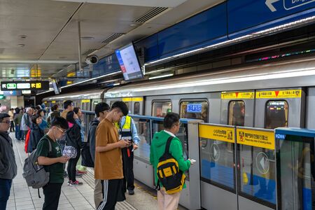 Taipei metro station hall and platform. Subway passengers walk through the enormous underground network of the Taipei Metro system.のeditorial素材