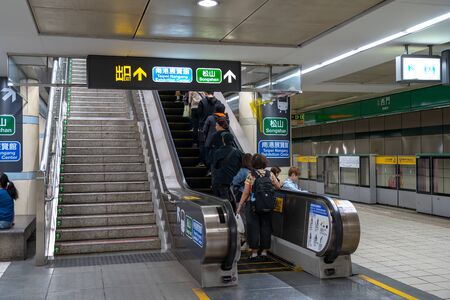 Taipei metro station hall and platform. Subway passengers walk through the enormous underground network of the Taipei Metro system.のeditorial素材