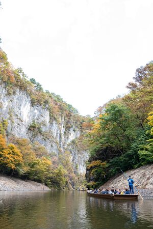 Geibikei Gorge River Cruises in Autumn foliage season. Beautiful scenery in sunny weather day. Ichinoseki, Iwate Prefecture, Japanのeditorial素材