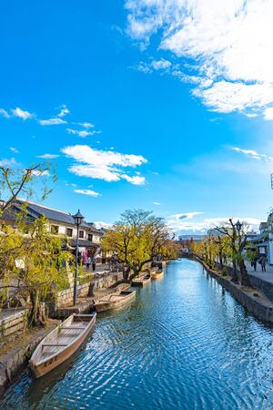 View of Kurashiki Bikan Historical Quarter. Townscape known for characteristically Japanese white walls of residences and willow trees lining banks of Kurashiki River , Okayama, Japanのeditorial素材