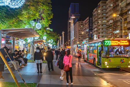 Night view of Xinyi Special Commercial Center, Department Stores, Hotel, Restaurant Clustered Close Together . The prime central business district of Taipei, Taiwanのeditorial素材