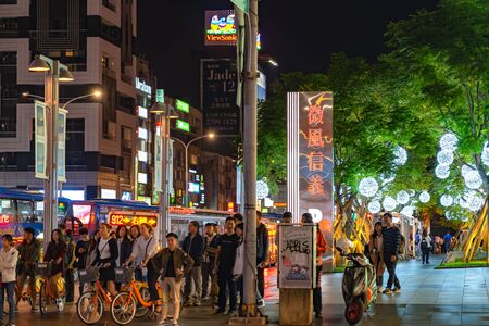 Night view of Xinyi Special Commercial Center, Department Stores, Hotel, Restaurant Clustered Close Together . The prime central business district of Taipei, Taiwanのeditorial素材