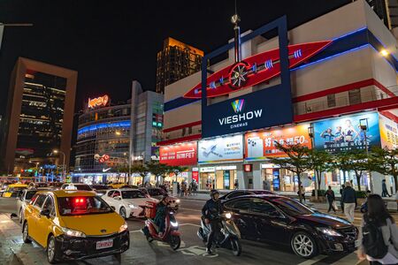 Night view of Xinyi Special Commercial Center, Department Stores, Hotel, Restaurant Clustered Close Together . The prime central business district of Taipei, Taiwanのeditorial素材