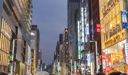 Night View of Ginza District, The District Has Famous Brand Flagship Stores Everywhere, Offers High End Retail Shopping. Text in Japan advertise stores name.のeditorial素材