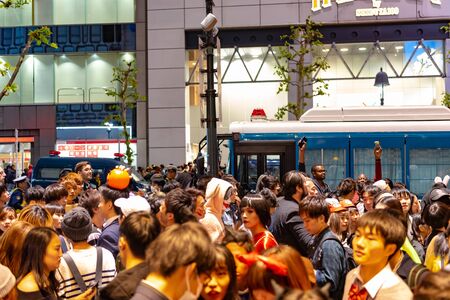 Unbelievable crowd of people in shibuya district during halloween celebration. Halloween has become...
