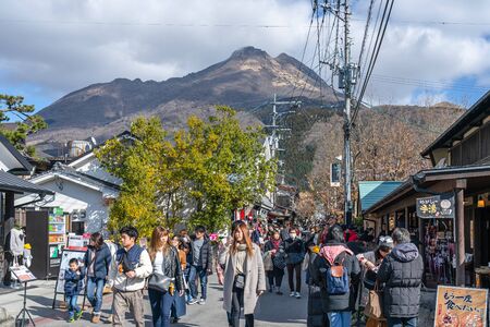 Townscape of Yufuin in Winter Sunny Day with Clear Blue Sky. Many Shops on the Street, Tours Come Here for Sightseeing in New Year Holidays. Yufuin, Oita Reflection, Japan