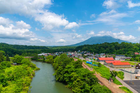 Townscape of Niseko in springtime sunny day with Mount Yotei in the background. A town located in Shiribeshi Subprefecture. Hokkaido, Japanのeditorial素材