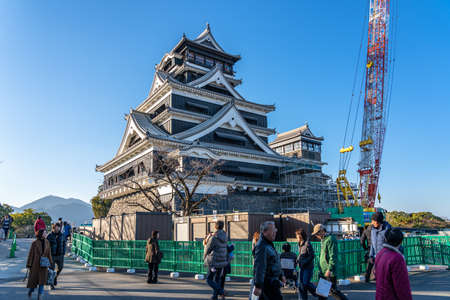Tourists visiting Kumamoto Castle in New Year holiday. The castle sustained damage in earthquake on 2016. In the present the efforts to repair the castle have begun. Kumamoto, Japanのeditorial素材