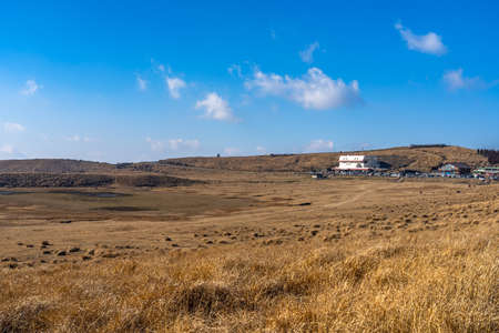 Kusasenri (kusasenri-ga-hama) prairie in Aso Kuju National Park. Aso Volcano Museum, shops, cafe, and restaurant are adjoining the large parking area. Kumamoto Prefecture, Japanのeditorial素材