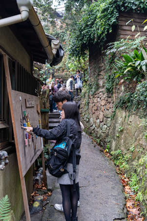 Neko-no-Hosomichi Cat Alley in Onomichi City. Lots of real and ornamental cats (fukuishi-neko), quaint cafes and galleries on this narrow street. Hiroshima Prefecture, Japanのeditorial素材