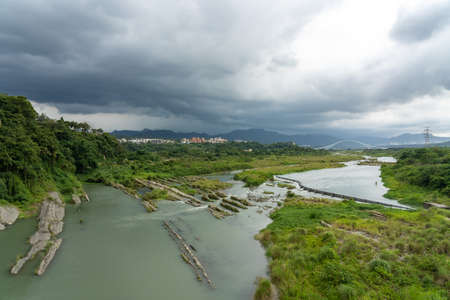 Dahan River, looking out from the Daxi Bridge, Daxi District, Taoyuan City, Taiwan.の写真素材