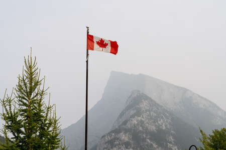 Banff, Alberta, Canada-SEP 14 2020: Downtown Banff Avenue as a haze. Smoke from the forest...