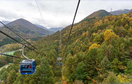 View of mountains and valleys from the Dragondola (Naeba-Tashiro Gondola) in autumn foliage season. Longest aerial gondola lift line in Japan.のeditorial素材