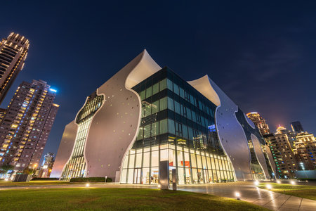 Exterior front view of National Taichung Theater light up at night. Taichung City, Taiwan.