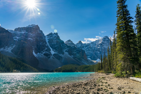 Moraine lake beautiful landscape in summer sunny day morning. Sparkle turquoise blue water, snow-covered Valley of the Ten Peaks. Banff National Park, Canadian Rockies, Alberta, Canadaの写真素材