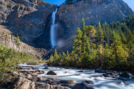 Takakkaw Falls Waterfall and Yoho River in a sunny summer day. Natural scenery landscape in Yoho National Park, Canadian Rockies, British Columbia, Canada.の写真素材