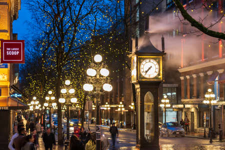 Gastown Steam Clock and downtown beautiful street view on a rainy night. Cambie and Water Street. Vancouver, Canada.のeditorial素材