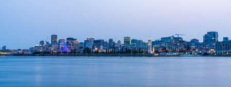 View of downtown Montreal city skyline and Saint Lawrence River at dusk, Quebec, Canada.の写真素材