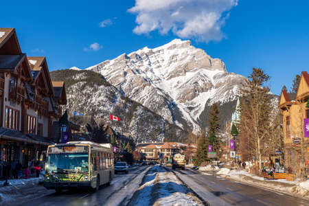 Banff, Alberta, Canada - January 23 2022 : Downtown Banff Avenue in a winter sunny day, during the pandemic period.のeditorial素材