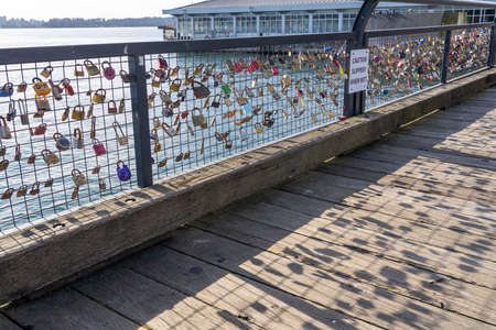 Love Locks locked on the fence at Lonsdale Quay Market in North Vancouver, Canada.のeditorial素材