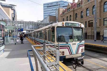 Calgary, AB, Canada - March 14 2022 : Train stop at City Hall station. Downtown Calgary.