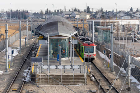 Calgary, AB, Canada - March 14 2022 : CTrain stop by McKnight Westwinds stations platform. CTrain light rail system. Calgary Transit.のeditorial素材