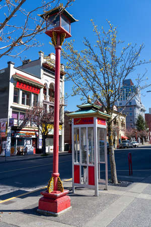 Victoria, BC, Canada - April 14 2021 : Chinese style telephone booth and street light in Victoria Chinatown.のeditorial素材
